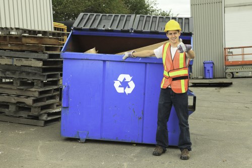 Fleet of skip hire vehicles parked and inspected before shift